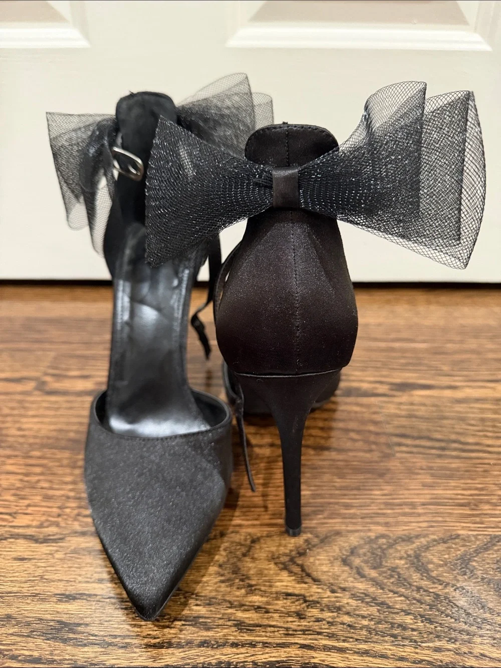 Elegant Black Pointed-Toe Ankle-Strap Heels with Bow Accent